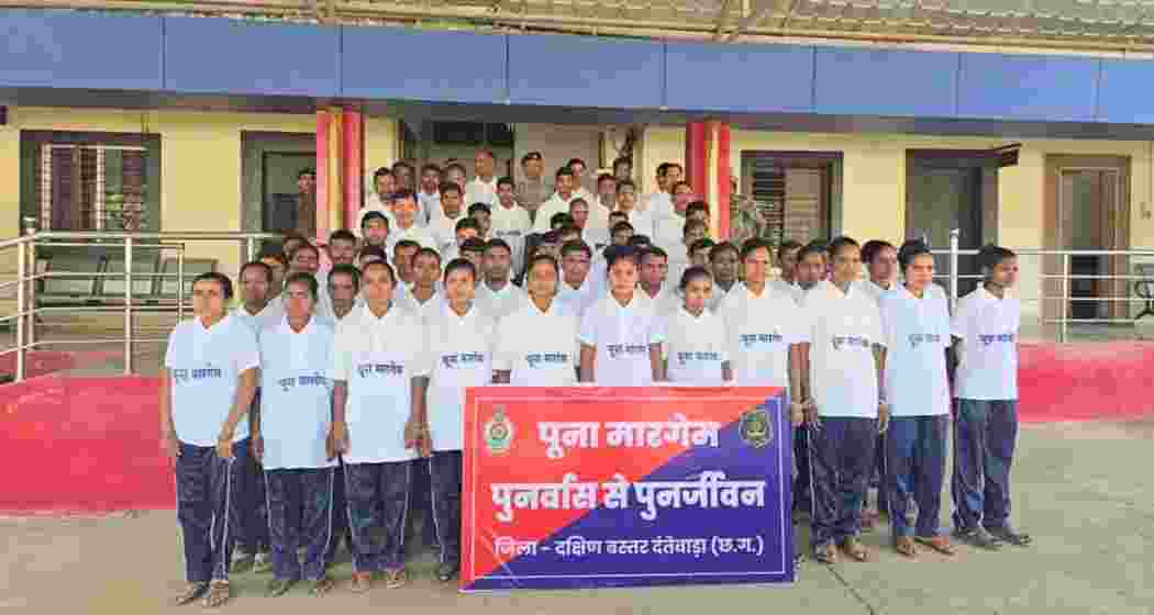 Surrendered Naxalites stand with senior police and CRPF officials in Dantewada on Friday after laying down arms under the state’s ‘Poona Margem’ rehabilitation initiative. Surrendered Naxalites stand with senior police and CRPF officials in Dantewada on Friday after laying down arms under the state’s ‘Poona Margem’ rehabilitation initiative.