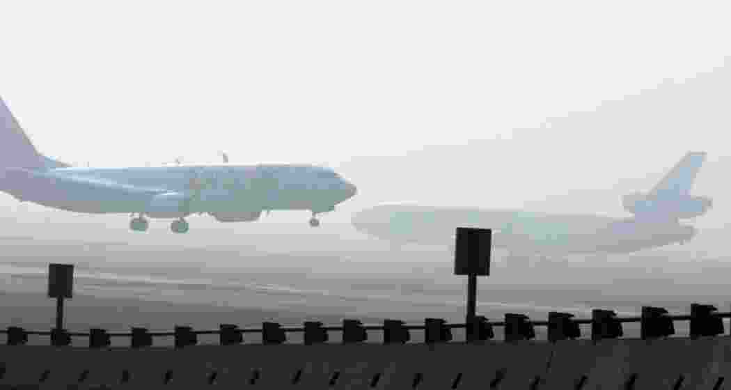 Dense fog envelops Delhi airport, disrupting over 100 flights and slowing traffic, as CAT III-compliant flights continue operations amidst low visibility conditions.Image for representative use only. Dense fog envelops Delhi airport, disrupting over 100 flights and slowing traffic, as CAT III-compliant flights continue operations amidst low visibility conditions.Image for representative use only.