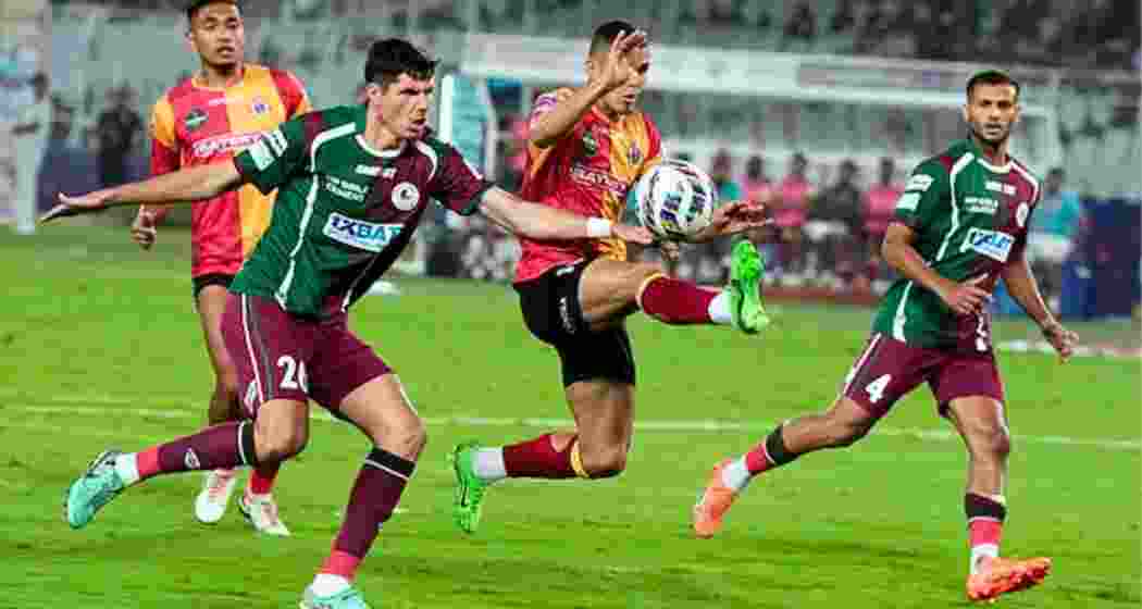 East Bengal and Mohun Bagan Super Giant players in action. East Bengal and Mohun Bagan Super Giant players in action.