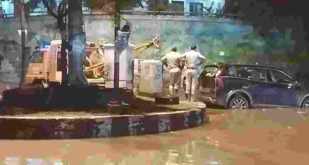 Police inspect the flooded area as they attempt to tow the SUV where the tragic incident occurred. Police inspect the flooded area as they attempt to tow the SUV where the tragic incident occurred.