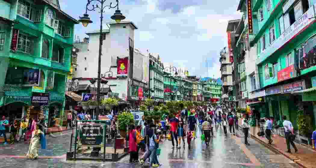 People stroll along MG Road in Gangtok, the capital of Sikkim. The state has replaced physical permits with mandatory online clearance for foreign tourists visiting sensitive border regions. People stroll along MG Road in Gangtok, the capital of Sikkim. The state has replaced physical permits with mandatory online clearance for foreign tourists visiting sensitive border regions.