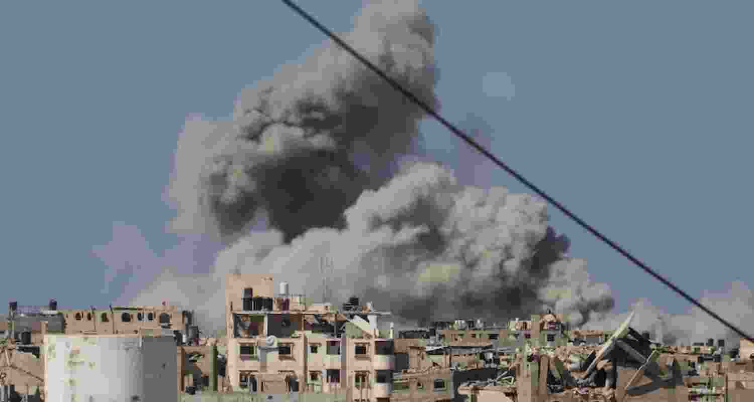 Smoke rises into the sky following an Israeli army air strike in Khan Younis in the Gaza Strip. Smoke rises into the sky following an Israeli army air strike in Khan Younis in the Gaza Strip.