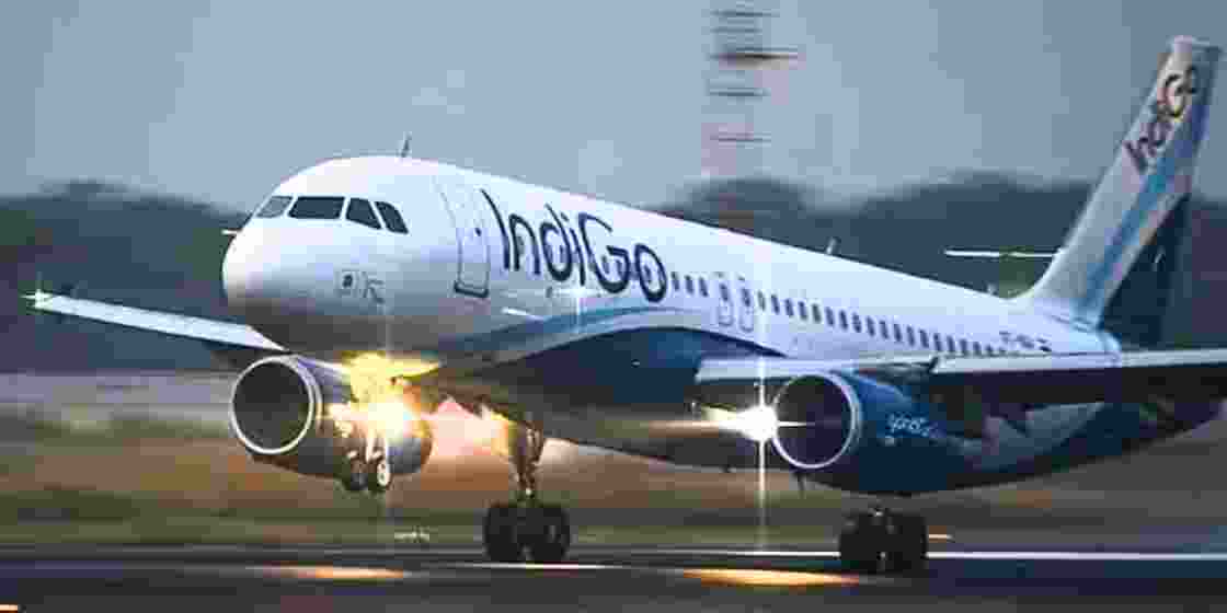An IndiGo aircraft takes off from the runway. An IndiGo aircraft takes off from the runway.