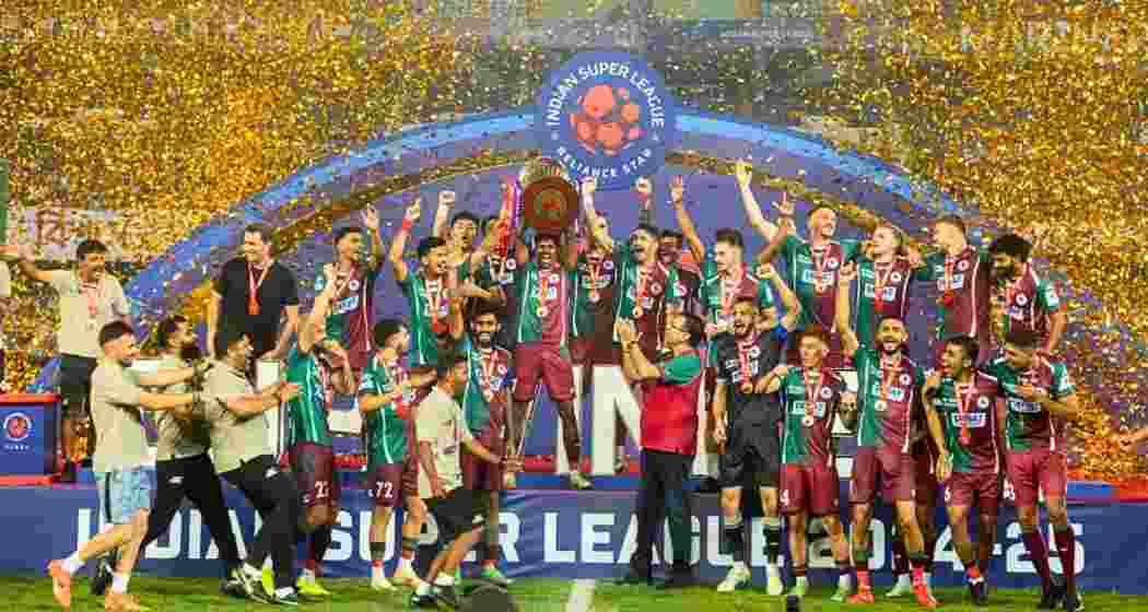 Mohun Bagan players celebrate at Salt Lake Stadium in Kolkata on Thursday after lifting the ISL Cup, completing their maiden league-and-cup double with a 2-1 extra-time win over Bengaluru FC. Mohun Bagan players celebrate at Salt Lake Stadium in Kolkata on Thursday after lifting the ISL Cup, completing their maiden league-and-cup double with a 2-1 extra-time win over Bengaluru FC.
