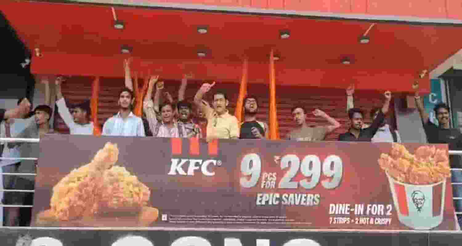Screengrab from the video, which shows people protesting to shut KFC at Ghaziabad during the month of Shravan. Screengrab from the video, which shows people protesting to shut KFC at Ghaziabad during the month of Shravan.