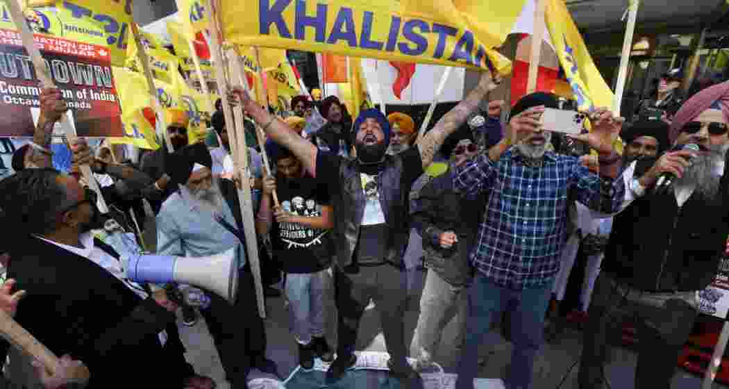 Demonstrators stand on a cardboard cutout of Indian Prime Minister Narendra Modi during a protest outside India's consulate, a week after Canada's Prime Minister Justin Trudeau raised the prospect of New Delhi's involvement in the murder of Sikh separatist leader Hardeep Singh Nijjar. Demonstrators stand on a cardboard cutout of Indian Prime Minister Narendra Modi during a protest outside India's consulate, a week after Canada's Prime Minister Justin Trudeau raised the prospect of New Delhi's involvement in the murder of Sikh separatist leader Hardeep Singh Nijjar.