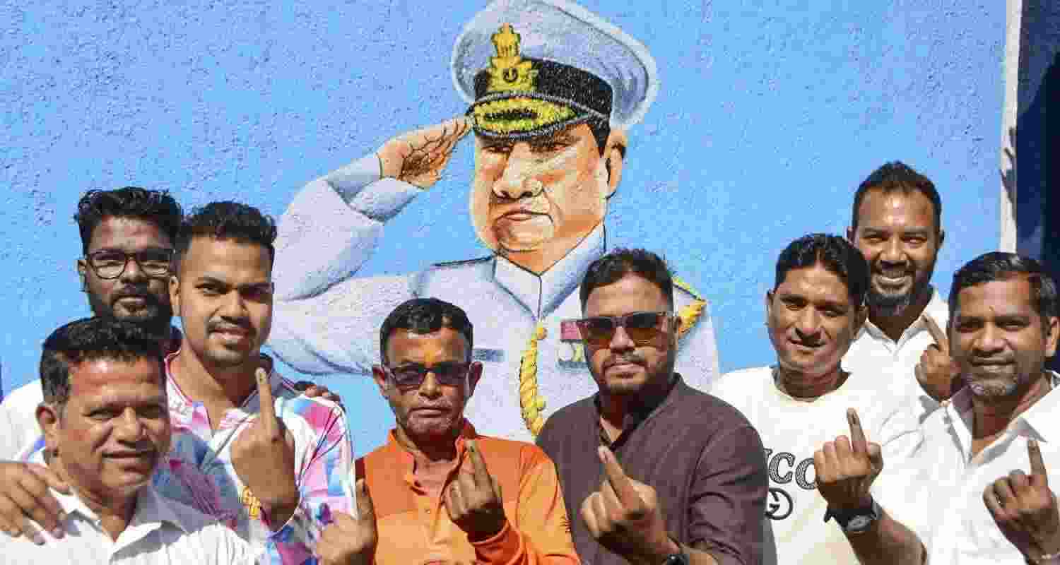 Voters show their ink-marked fingers after casting their votes at a polling station during the Brihanmumbai Municipal Corporation elections in Mumbai, Maharashtra Voters show their ink-marked fingers after casting their votes at a polling station during the Brihanmumbai Municipal Corporation elections in Mumbai, Maharashtra