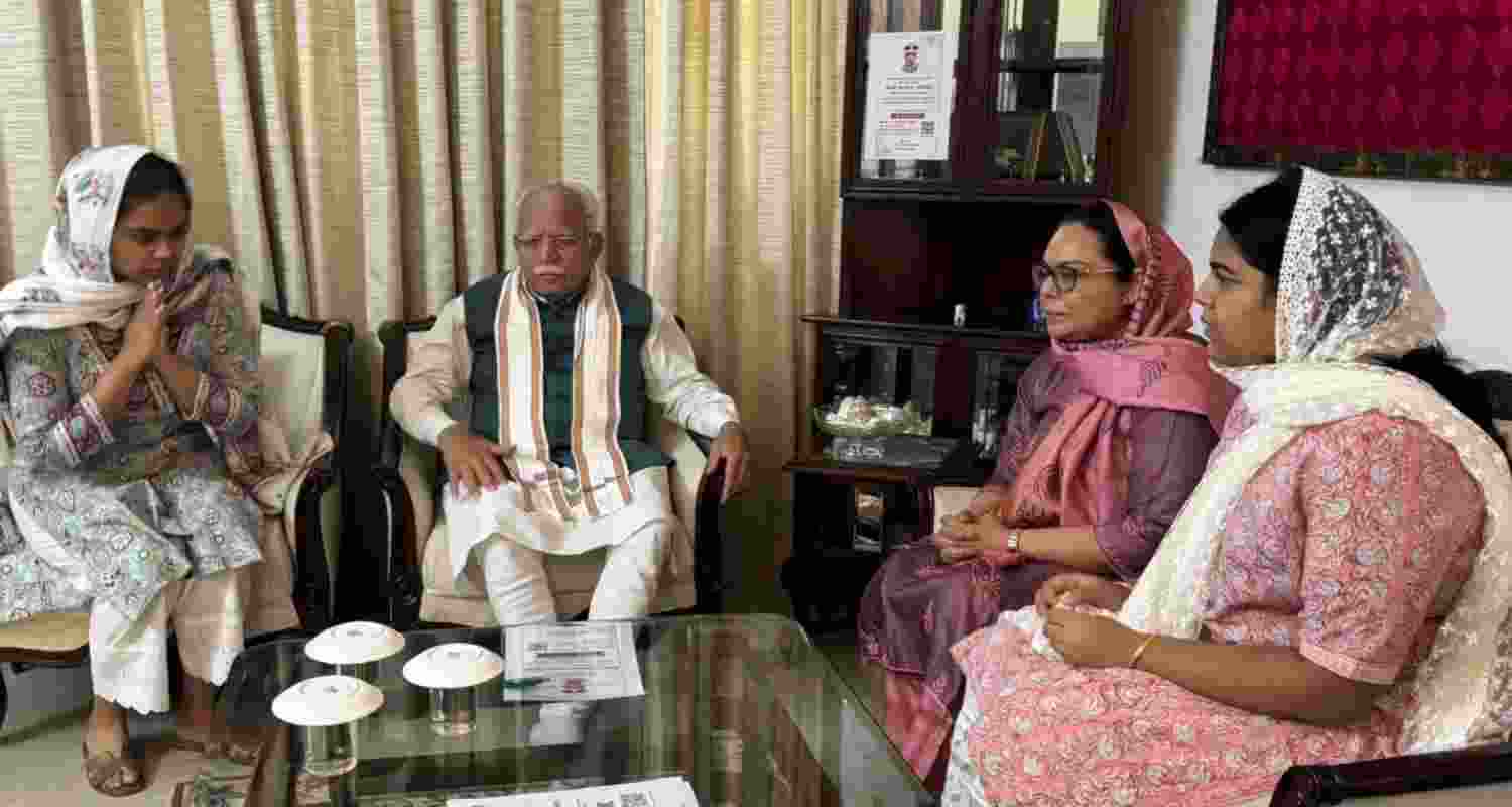 Union Minister Manohar Lal Khattar met the family of late Haryana IPS officer Y Puran Kumar. Union Minister Manohar Lal Khattar met the family of late Haryana IPS officer Y Puran Kumar.