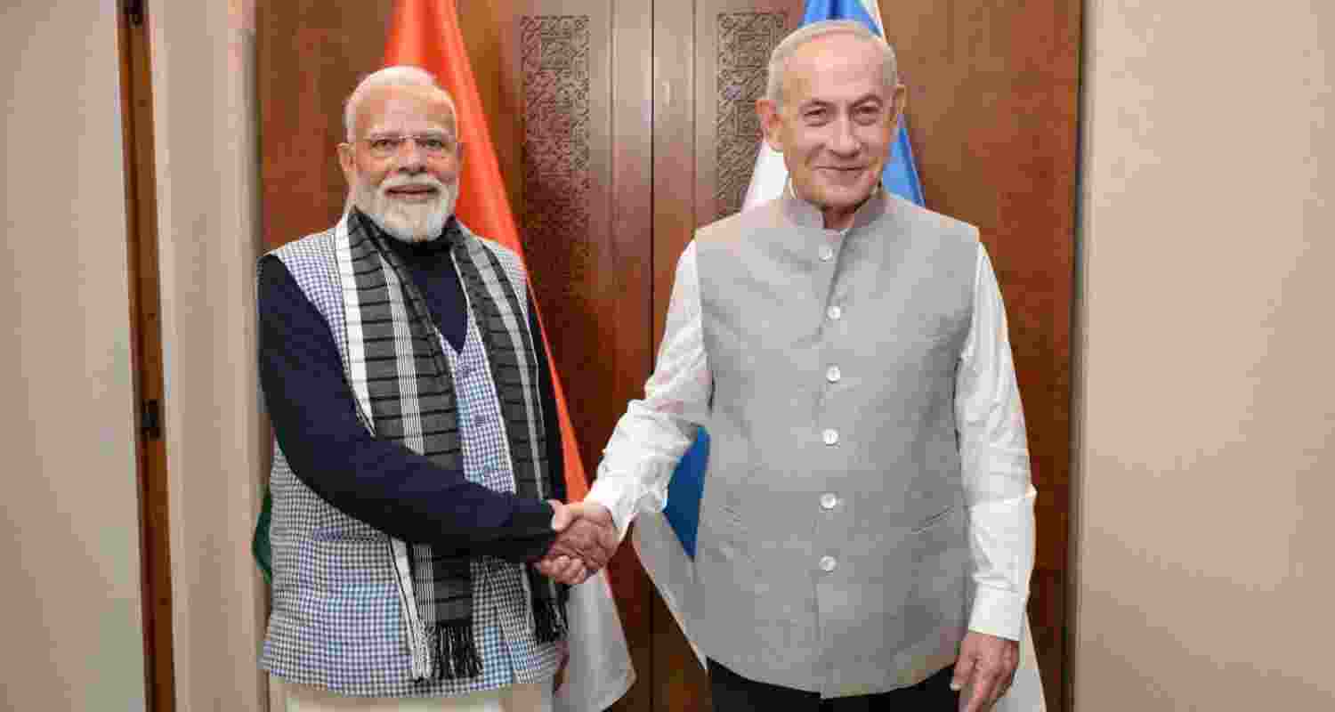 Israeli Prime Minister Benjamin Netanyahu, with PM Narendra Modi, in traditional Indian attire for their dinner meeting in Tel Aviv. Israeli Prime Minister Benjamin Netanyahu, with PM Narendra Modi, in traditional Indian attire for their dinner meeting in Tel Aviv.