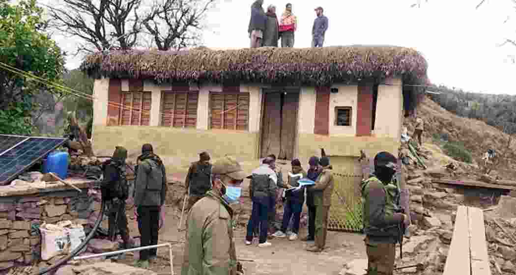 Officials and experts investigate a house in Rajouri district amid a mysterious illness outbreak, which has tragically claimed 17 lives. Officials and experts investigate a house in Rajouri district amid a mysterious illness outbreak, which has tragically claimed 17 lives.