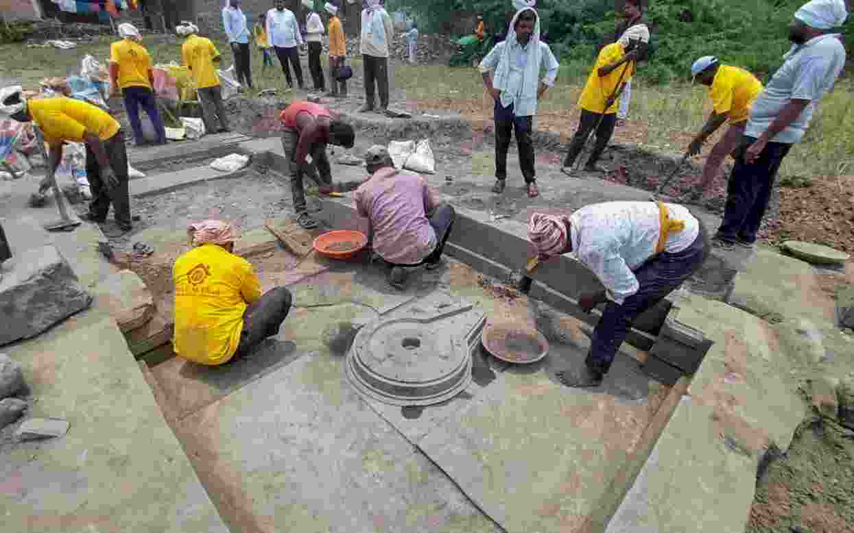 As part of conservation work on historic temples, a team of archaeology department officials discovered the temple base while clearing debris near a temple under restoration at Hottal Village in Maharashtra's Nanded district As part of conservation work on historic temples, a team of archaeology department officials discovered the temple base while clearing debris near a temple under restoration at Hottal Village in Maharashtra's Nanded district