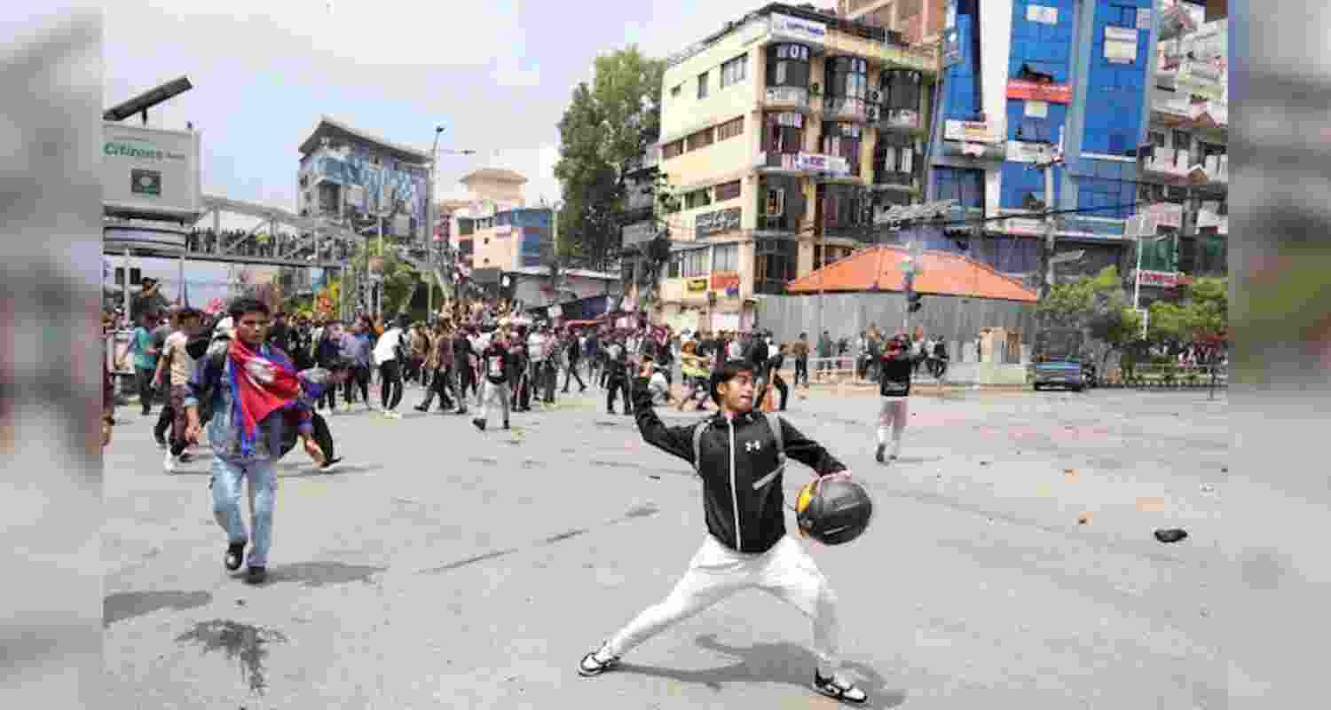 Protestors clash with the riot police outside the Parliament building in Kathmandu, Nepal, Monday. Protestors clash with the riot police outside the Parliament building in Kathmandu, Nepal, Monday.