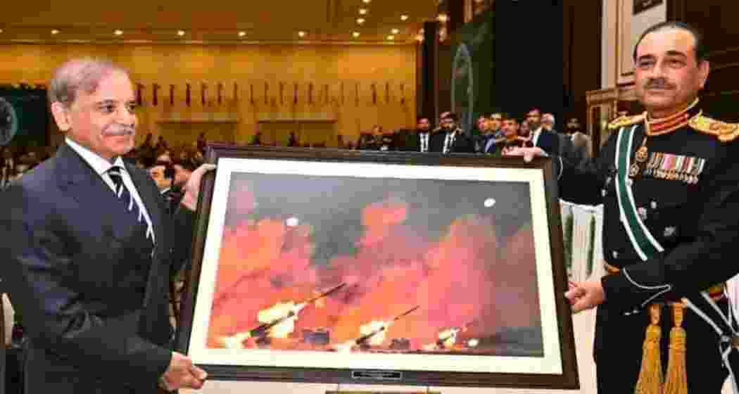 Pakistan Army Chief Asim Munir gifts an old image of a Chinese military drill to PM Shehbaz Sharif, falsely portraying it as a Pakistani strike over India. Pakistan Army Chief Asim Munir gifts an old image of a Chinese military drill to PM Shehbaz Sharif, falsely portraying it as a Pakistani strike over India.