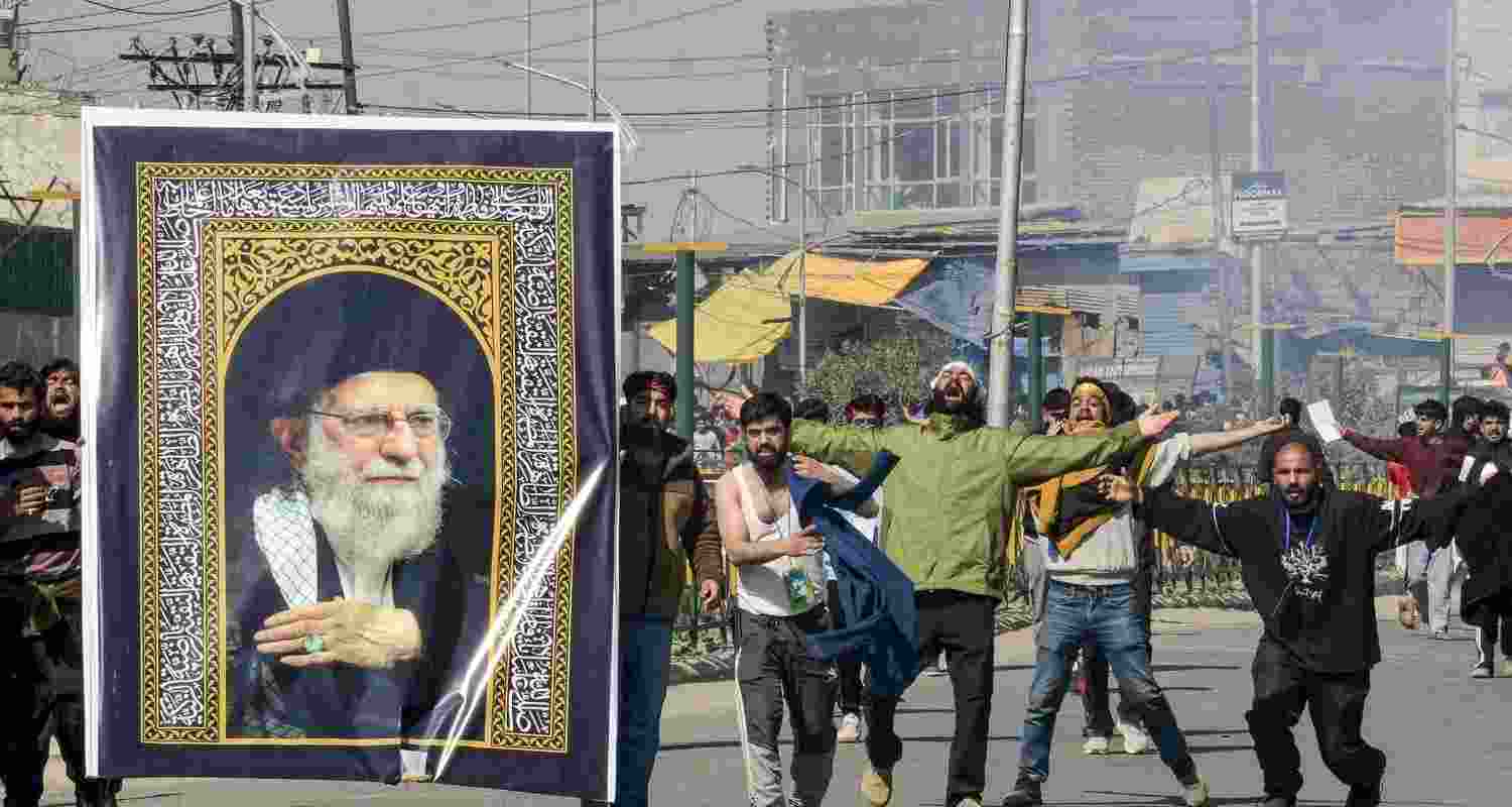 People stage a protest over the killing of Iran's Supreme Leader Ayatollah Ali Khamenei, amid severe restrictions on the movement of people in parts of Kashmir on Monday. People stage a protest over the killing of Iran's Supreme Leader Ayatollah Ali Khamenei, amid severe restrictions on the movement of people in parts of Kashmir on Monday.