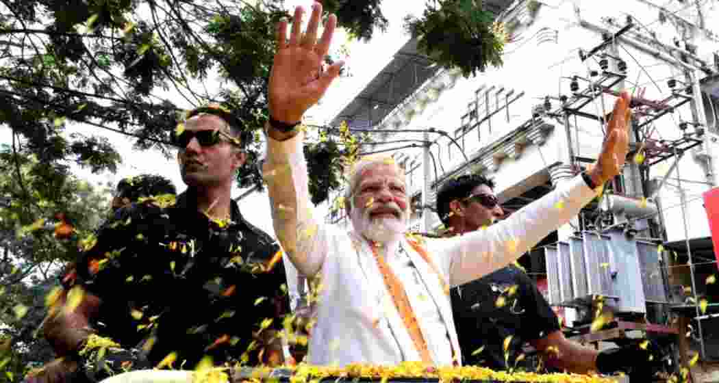 PM Modi during a roadshow. PM Modi during a roadshow.