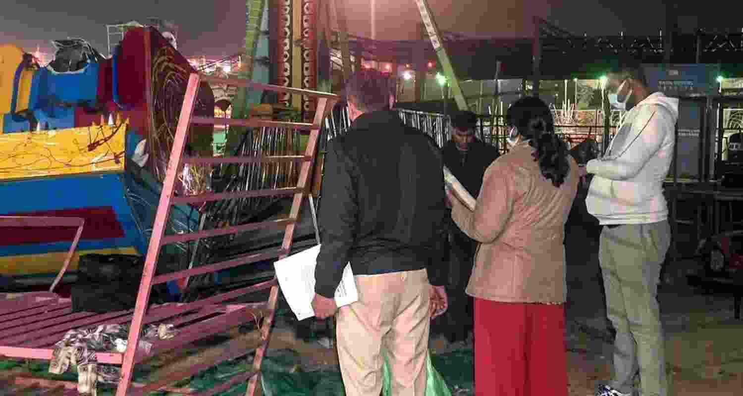 Police and forensic teams inspect the site after swing collapse at Surajkund Mela in Faridabad on Saturday. Police and forensic teams inspect the site after swing collapse at Surajkund Mela in Faridabad on Saturday.