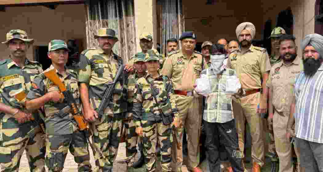 Police personnel hold a man arrested with 3.5 kilograms of heroin during a raid in Ferozepur last Friday, as part of Punjab’s intensified anti-narcotics crackdown. Police personnel hold a man arrested with 3.5 kilograms of heroin during a raid in Ferozepur last Friday, as part of Punjab’s intensified anti-narcotics crackdown.