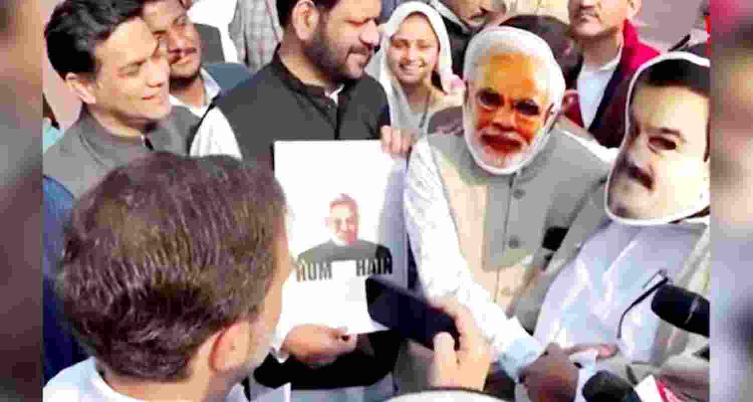 Congress MPs Manickam Tagore and Saptagiri Sankar Ulaka wore the masks as opposition protested in Parliament again. Congress MPs Manickam Tagore and Saptagiri Sankar Ulaka wore the masks as opposition protested in Parliament again.