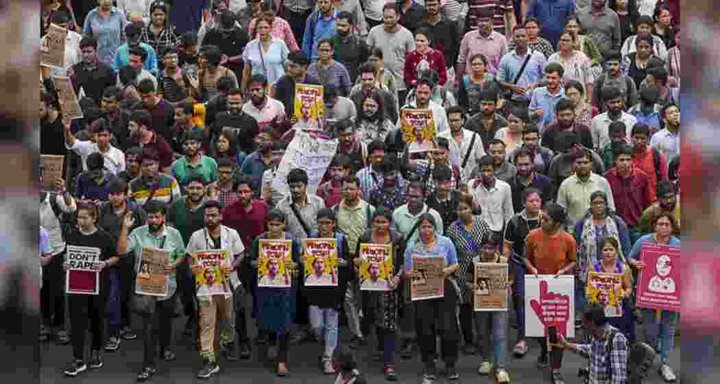 Doctors raise slogans during a protest rally over the recent alleged rape and murder of a trainee doctor at the RG Kar Medical College and Hospital, in Kolkata. Doctors raise slogans during a protest rally over the recent alleged rape and murder of a trainee doctor at the RG Kar Medical College and Hospital, in Kolkata.