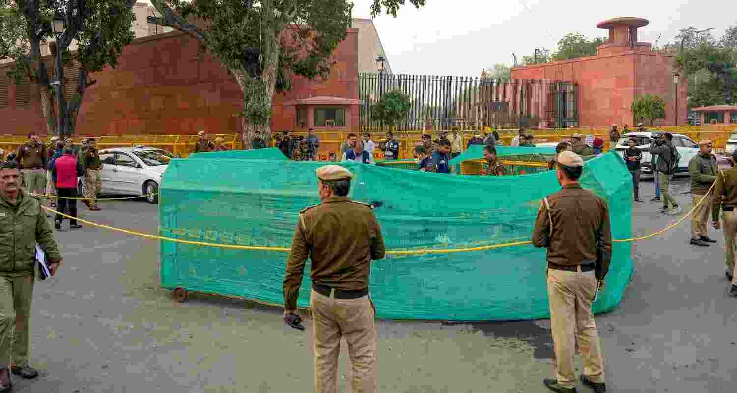 Delhi Police personnel during investigation at the site where a man tried to immolate himself near the Railway Bhawan opposite the new Parliament building, in New Delhi, Wednesday, Dec. 25, 2024. Delhi Police personnel during investigation at the site where a man tried to immolate himself near the Railway Bhawan opposite the new Parliament building, in New Delhi, Wednesday, Dec. 25, 2024.