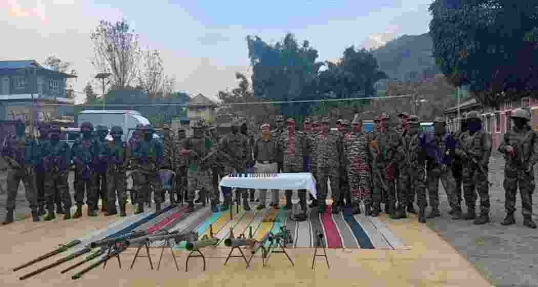 Security personnel stand guard with surrendered arms at the Commando unit in Lamlai, police stations in Porompat and Heingang, and the 7th Manipur Rifles battalion in Imphal East. Security personnel stand guard with surrendered arms at the Commando unit in Lamlai, police stations in Porompat and Heingang, and the 7th Manipur Rifles battalion in Imphal East.