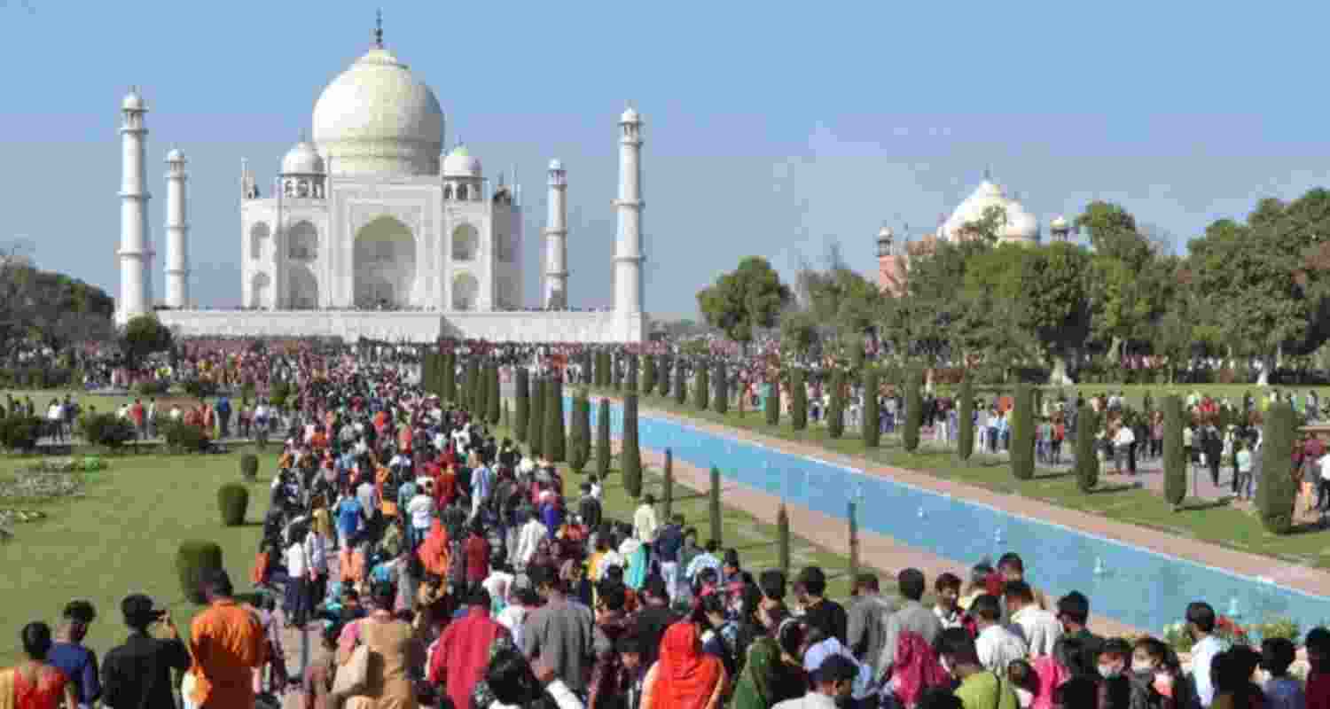 Tourists at the Taj Mahal in Agra, Uttar Pradesh - file image. Tourists at the Taj Mahal in Agra, Uttar Pradesh - file image.