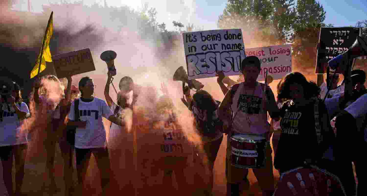 Demonstrators wave signs and shout slogans during a protest demanding the immediate release of all hostages held by Hamas and calling for the end of the war in the Gaza Strip, in Jerusalem. Demonstrators wave signs and shout slogans during a protest demanding the immediate release of all hostages held by Hamas and calling for the end of the war in the Gaza Strip, in Jerusalem.