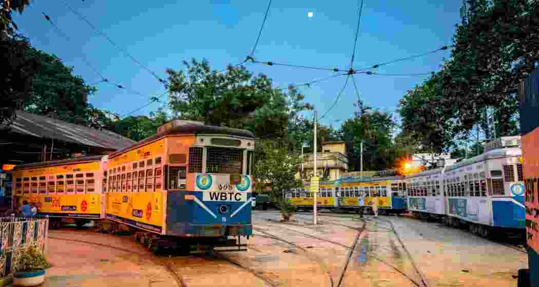 As dusk settles over the tram depot, Kolkata’s iconic trams stand shoulder to shoulder, bathed in the last light of the day. These old companions have carried generations through the streets of Kolkata. As dusk settles over the tram depot, Kolkata’s iconic trams stand shoulder to shoulder, bathed in the last light of the day. These old companions have carried generations through the streets of Kolkata.