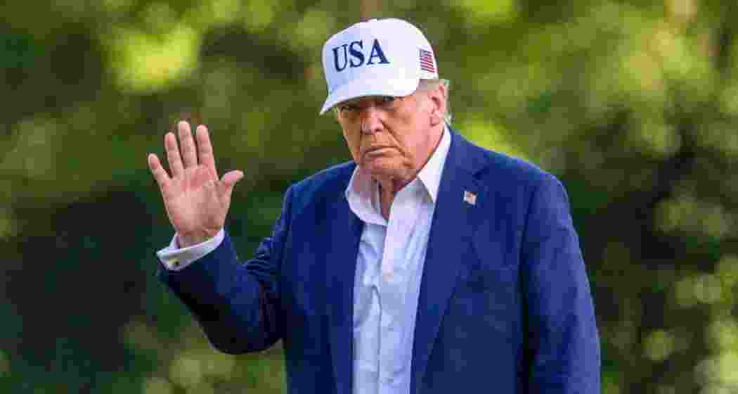 President Donald Trump walks across the South Lawn of the White House. President Donald Trump walks across the South Lawn of the White House.