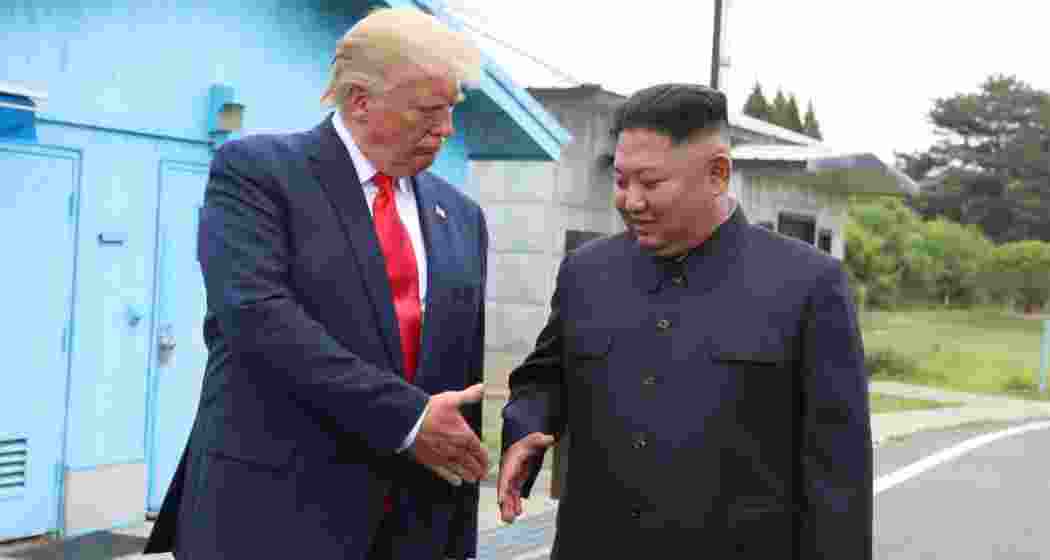 A handout photo from Dong-A Ilbo shows North Korean leader Kim Jong-un and U.S. President Donald Trump inside the Demilitarized Zone (DMZ) at Panmunjom, separating South and North Korea, during their historic meeting on June 30, 2019. A handout photo from Dong-A Ilbo shows North Korean leader Kim Jong-un and U.S. President Donald Trump inside the Demilitarized Zone (DMZ) at Panmunjom, separating South and North Korea, during their historic meeting on June 30, 2019.