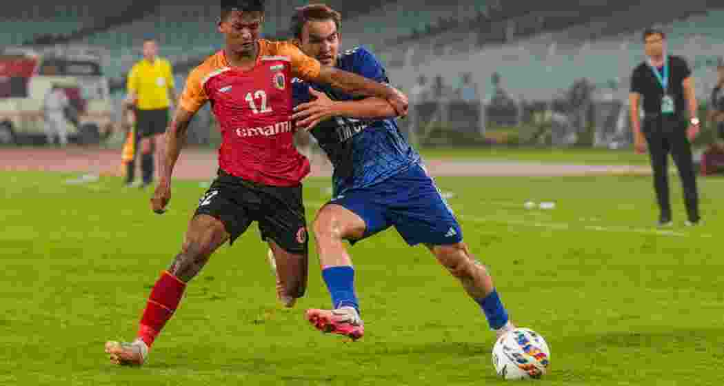 Players of East Bengal FC and Altyn Asyr FC vie for the ball during their AFC Champions League 2 match at VYBK Stadium, in Kolkata, Wednesday, Aug. 14, 2024. Players of East Bengal FC and Altyn Asyr FC vie for the ball during their AFC Champions League 2 match at VYBK Stadium, in Kolkata, Wednesday, Aug. 14, 2024.