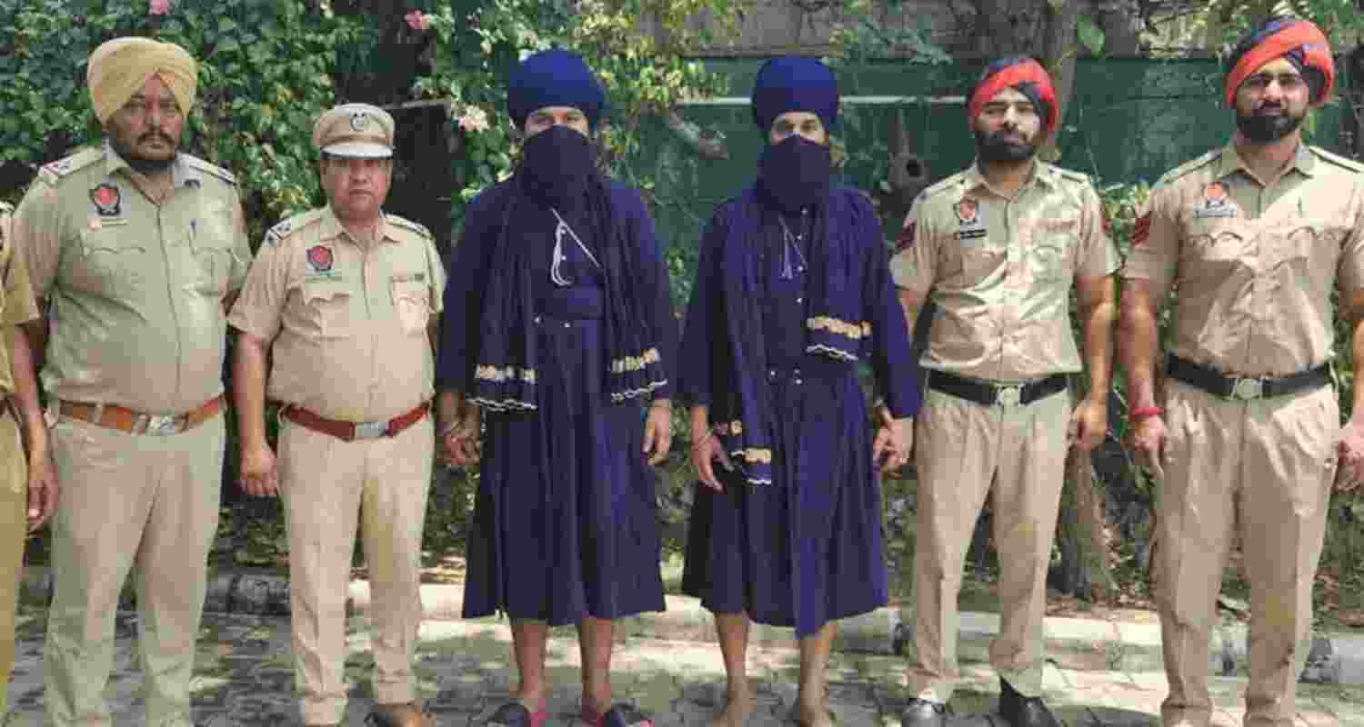 Police, with the two suspects, Nimaratjeet Singh and Jaspreet Singh, who were sent to judicial custody on Wednesday Police, with the two suspects, Nimaratjeet Singh and Jaspreet Singh, who were sent to judicial custody on Wednesday